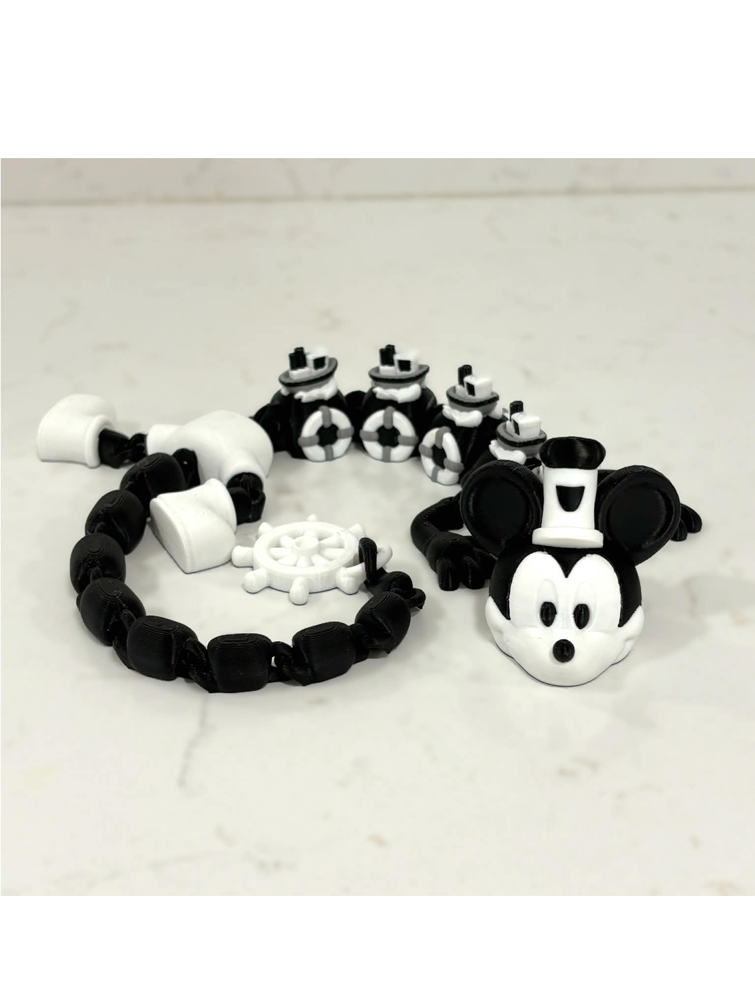 Black and white Steamboat Willie–inspired 3D printed dragon sculpture with a vintage cartoon style, high-contrast details, and a classic animation aesthetic, approximately 19 inches long.
